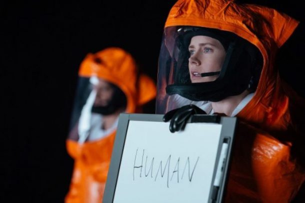 arrival-amy-adams-holds-human-sign-610x406